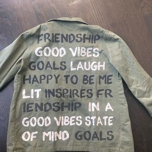me. n .u forest green jacket. With inspirational words on the back. Size XL